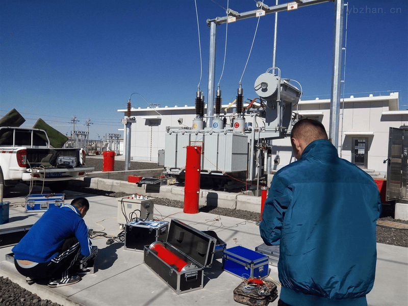 A technician using testing equipment on a transformer before installation